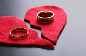 Broken heart with wedding rings
